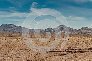 Plain desert floor in front of mountains, Nelson Nevada USA