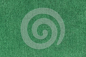 Plain green velours fleecy upholstery fabric texture background.