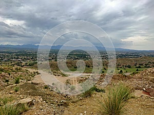 plain hills eith beautiful little greenery under beautiful white  sky