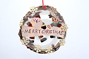 Plain holiday wreath with Merry Christmas sign on white background