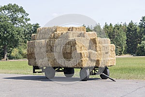 Plain old farm wagon with straw bales stacked