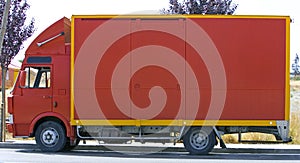 Plain red lorry or van side view