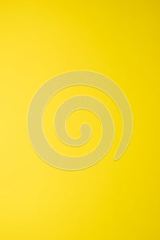 plain texture of a yellow gradient, vertical image, empty background