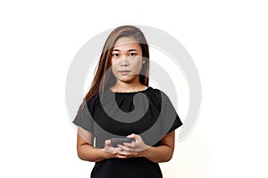 Plain white background with space for text. Asian lady wearing face mask for protection against coronavirus. Half body view young