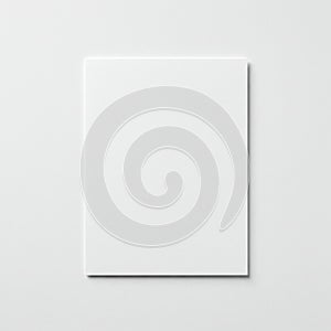 A plain, white sheet of paper is centered on a smooth, white background. The paper's