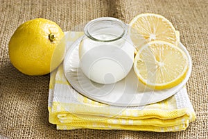 Plain yogurt in a jar with lemon