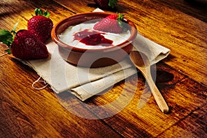 Plain yogurt with strawberry jam and strawberries, a delicious simple and healthy dessert from our Mediterranean diet