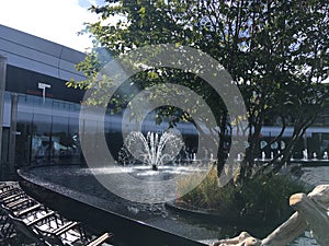 PLAISIR, FRANCE - Sep 24, 2020: A fountain in the middle of a shopping centre photo
