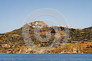 Plaka Town on Milos Island, Greece, situated on a hill with row of traditional whitewashed cycladic houses