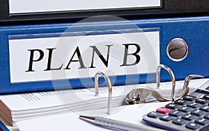 Plan B - blue binder with text in the office