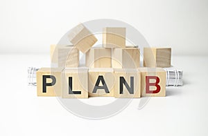 plan b word written on wood block. white background and  cubes