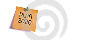 Plan new year 2020 on the orange sticky note