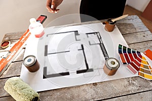 Plan of renovation of house on old wooden table. Top view