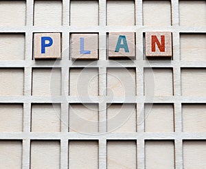 Plan the word arranged with wooden letters