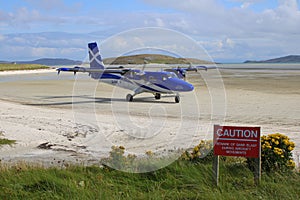 Plane arriving at beach airport