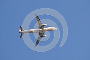 The plane in the clear blue sky