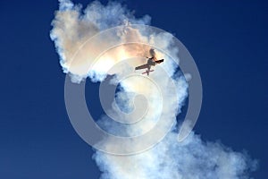 Plane in the cloud of smoke