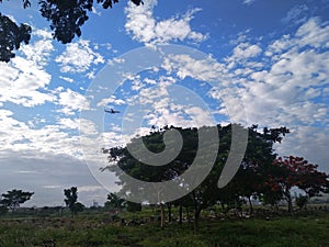 the plane that crosses the blue sky