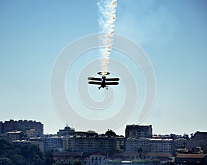 Plane doing stunts and dropping smoke