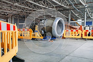 Plane engine without covers, maintenance in hangar