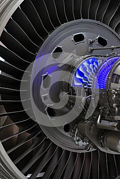 Plane engine element. Turbine blades. Blue light