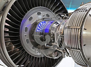 Plane engine element. Turbine blades. Blue light