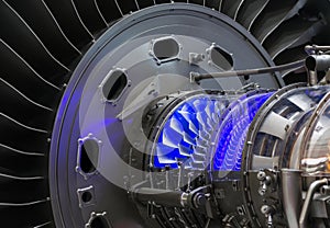 Plane engine element. Turbine blades. Blue light