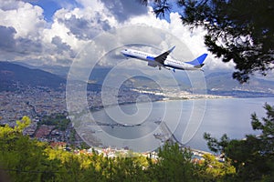 The plane flies over the Mediterranean Sea over the Turkish resort towns.