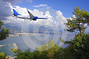 The plane flies over the Mediterranean Sea over the Turkish resort towns.