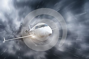 The plane flies during a storm and heavy rain overcast