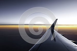 Plane flight at sunset
