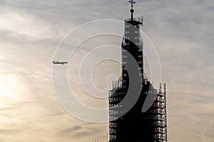Plane flying into a building under construction