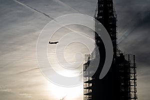 Plane flying into a building under construction