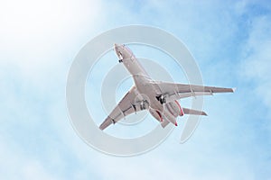 Plane flying through clouds in the sky. Jet aircraft.