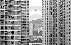 Plane flying between High-Rise Residential Buildings, Hong Kong