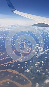 Plane flying over the Amazonas river