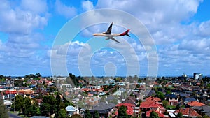 plane flying over Melbournes suburbs and CBD looking down at Houses roads and Parks Victoria Australia