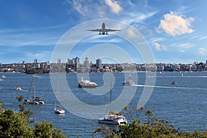 Plane flying over Sydney Harbour Sydney NSW Australia.