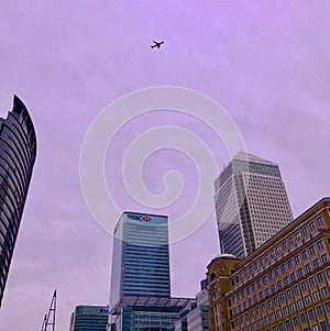 Airliner flying over Canary Wharf in London