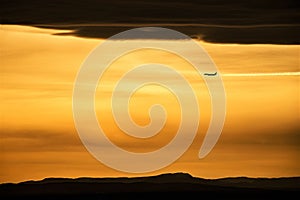 the plane is flying in the sky