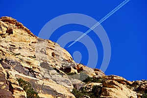 A plane flying on top of a hill at Red Rock Canyon, Nevada, U.S.A