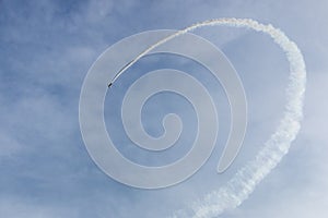 Plane flying upside down upon the lake