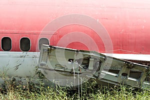 Plane fuselage wreckage sitting on the ground