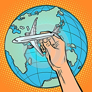 Plane in hand. metaphor of flight to the Eastern hemisphere