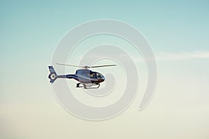Plane helicopter flying a background of blue sky
