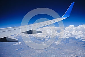 Plane horizon aerial view. Airplane wing sky view