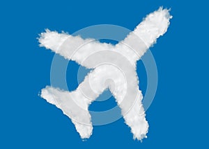 Plane icon shape made of clouds on blue