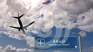 Plane landing in Abuja Nigeria airport with signboard