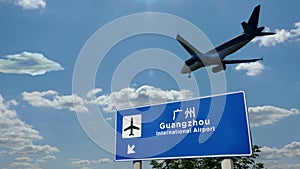 Plane landing in Guangzhou China airport with signboard