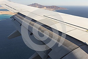 The plane lands on the airfield. Spoilers and flaps trailing edge when landing. photo